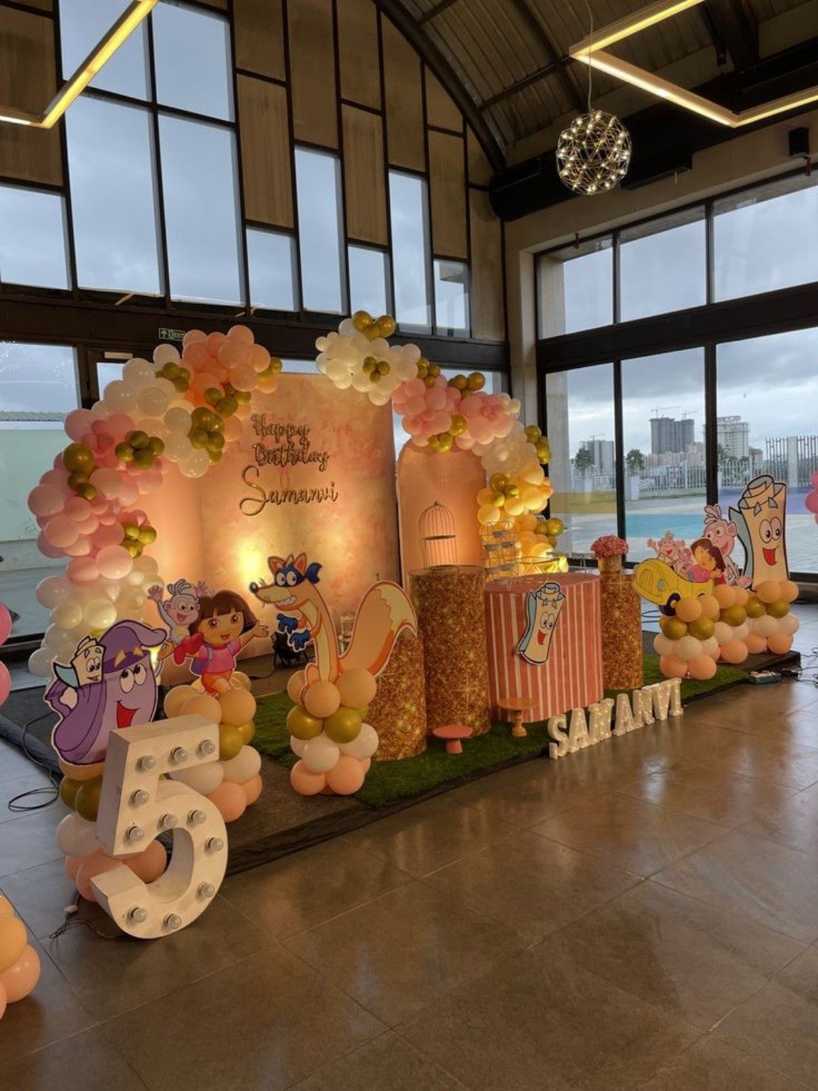 Kids cartoon themed birthday decoration with balloons